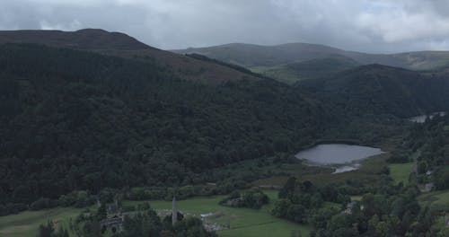 Aerial Footage Of A Beautiful Landscape Of A Town In The Outskirts