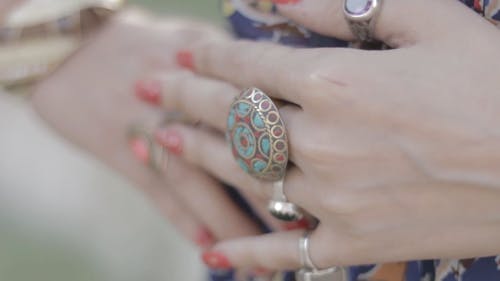 A Woman With Rings On Her Fingers