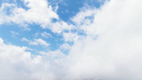 Cloudy Skies Above A Foggy Mountain