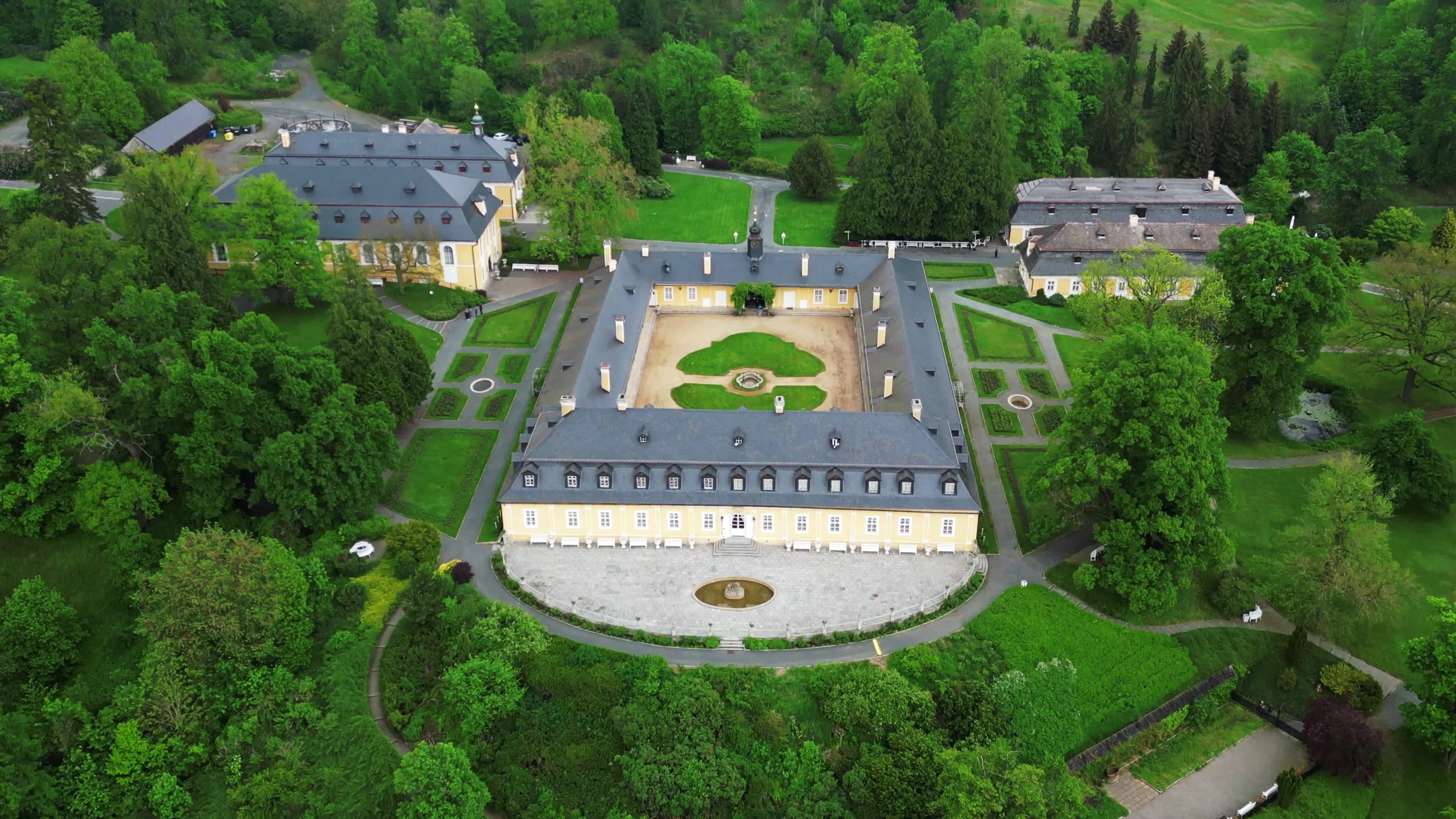 An aerial view of a castle surrounded by trees Free Stock Video Footage ...