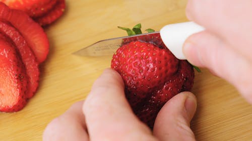 Cutting Off A The Strawberry Calyx