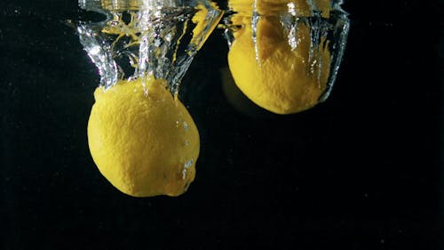 Dropping Lemons In Water