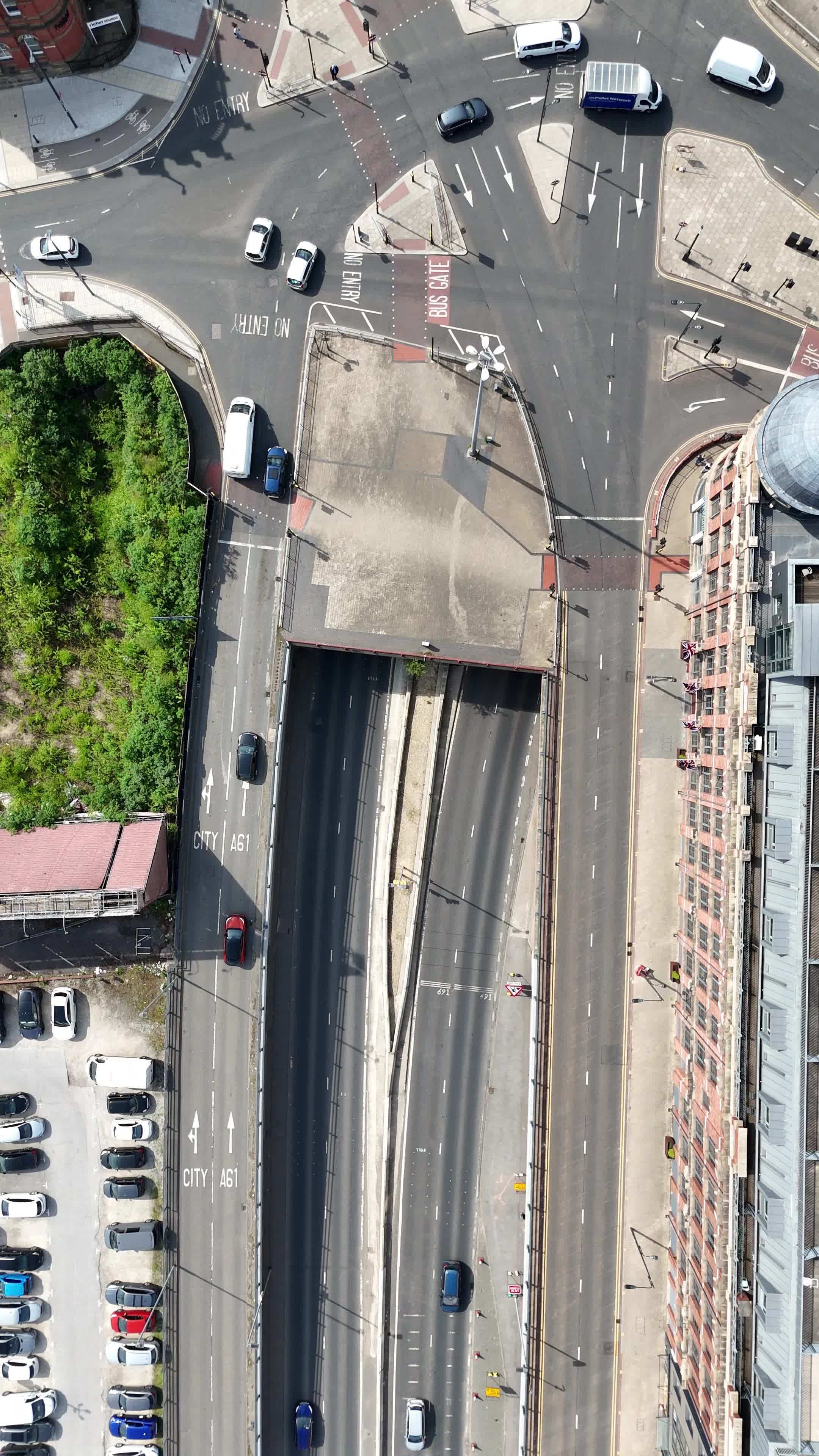 An aerial view of a city street with cars and buildings Free Stock ...