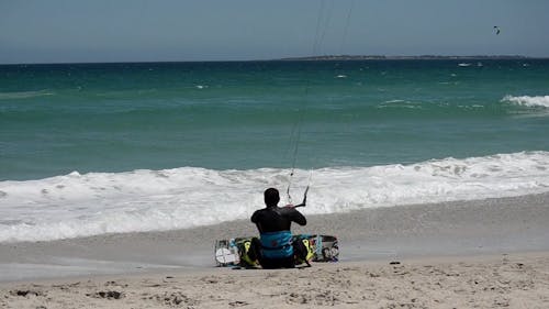 A Man Kite Surfing In The Sea