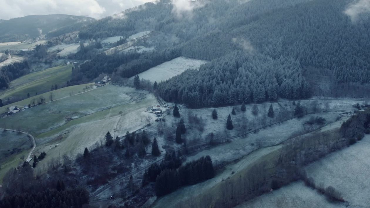 Aerial view of a snowy landscape with a small village Free Stock Video ...