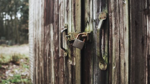 A Weather-worn Barn Door And Lock