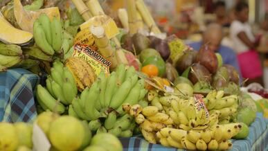 a fruit stand with many different types of fruit