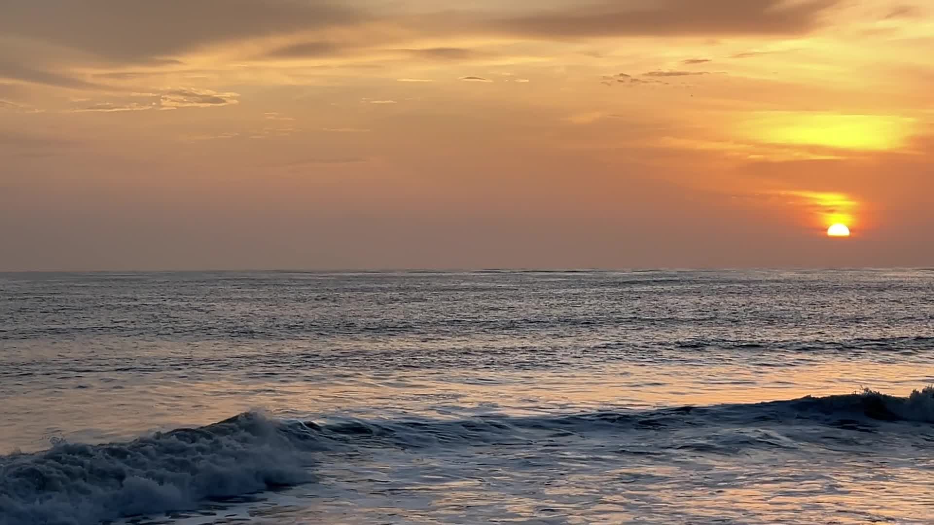 The sun sets over the ocean with waves Free Stock Video Footage ...