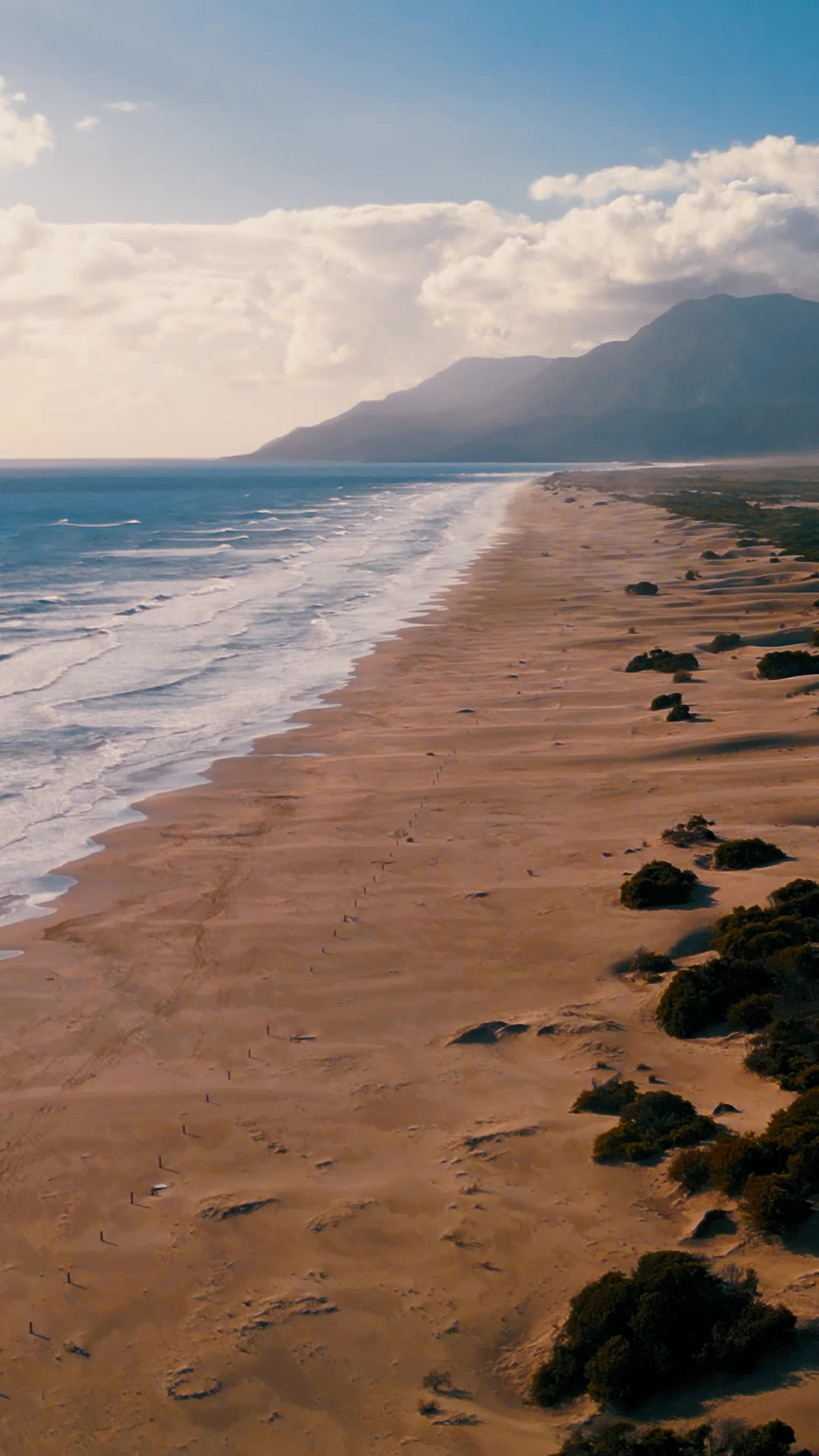 The beach is a long stretch of sand with waves Free Stock Video Footage ...