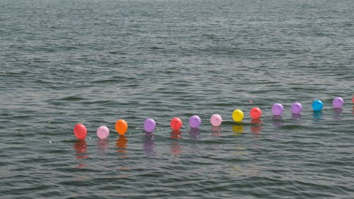 Colorful balloons in the sea