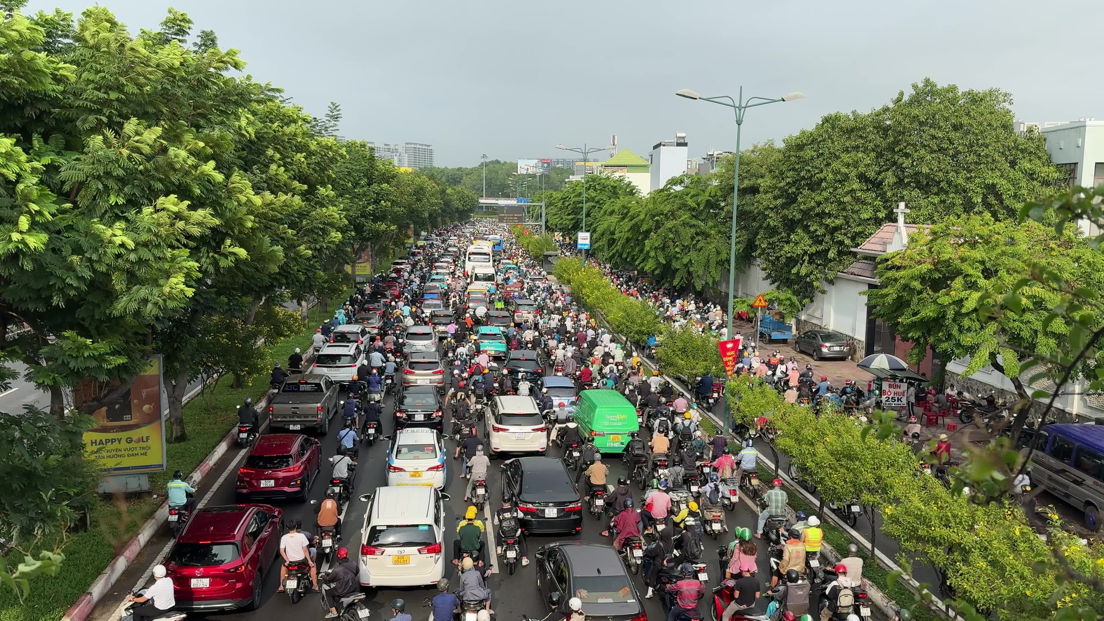 A busy street with many cars and motorcycles Free Stock Video Footage ...