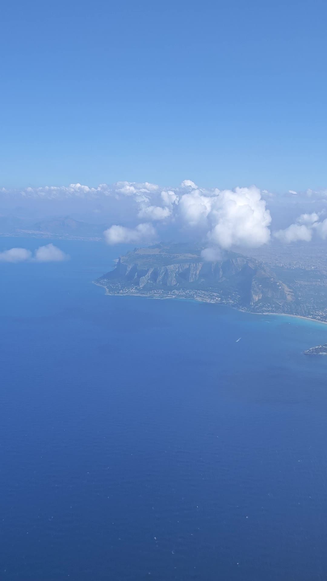 A view from an airplane window of the ocean and clouds Free Stock Video ...