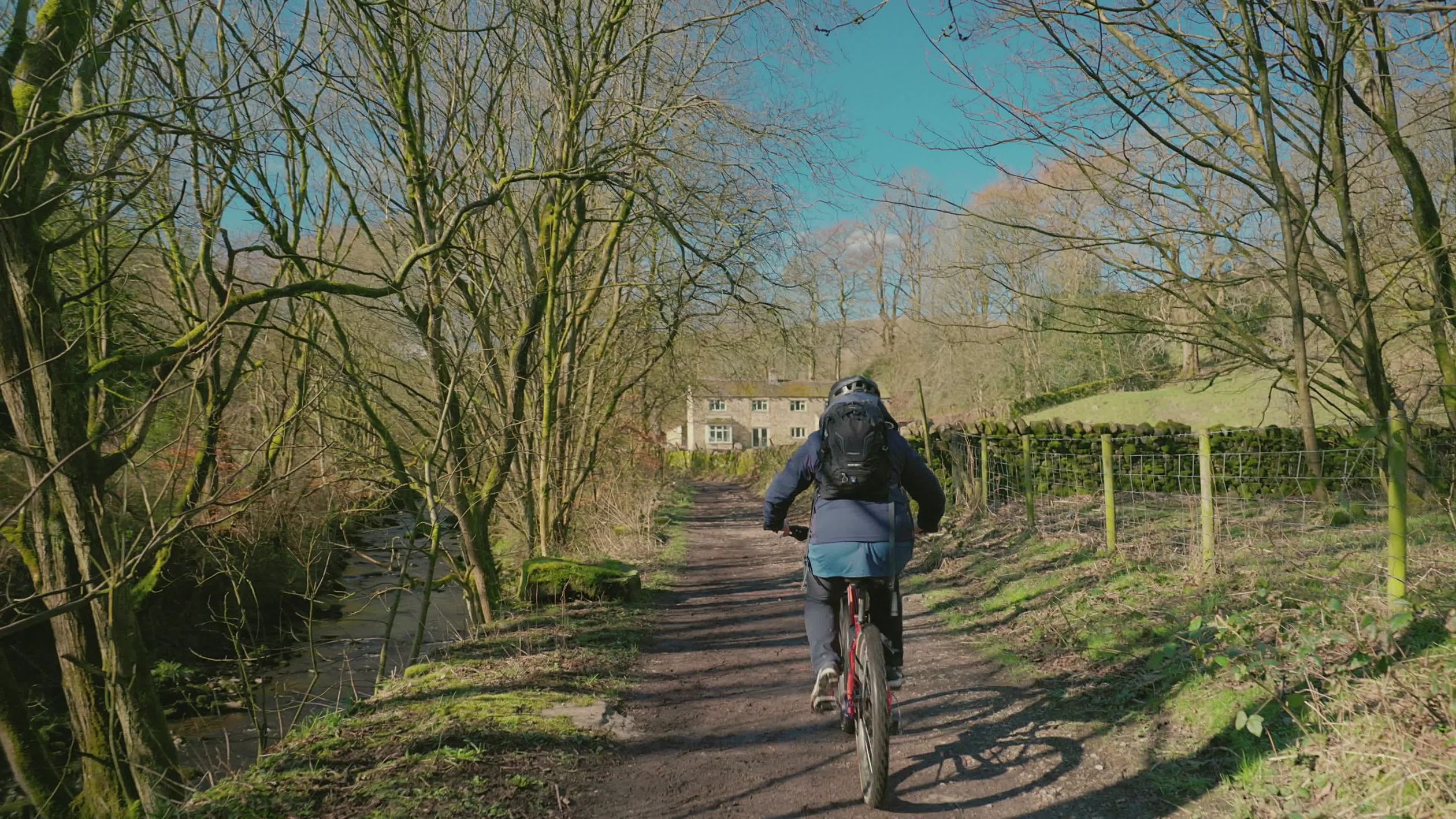 A person on a bike rides down a path Free Stock Video Footage, Royalty ...