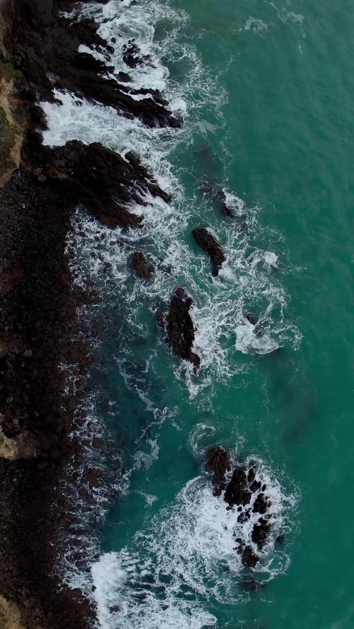 Aerial View of Rugged Coastline and Crashing Waves Free Stock Video ...