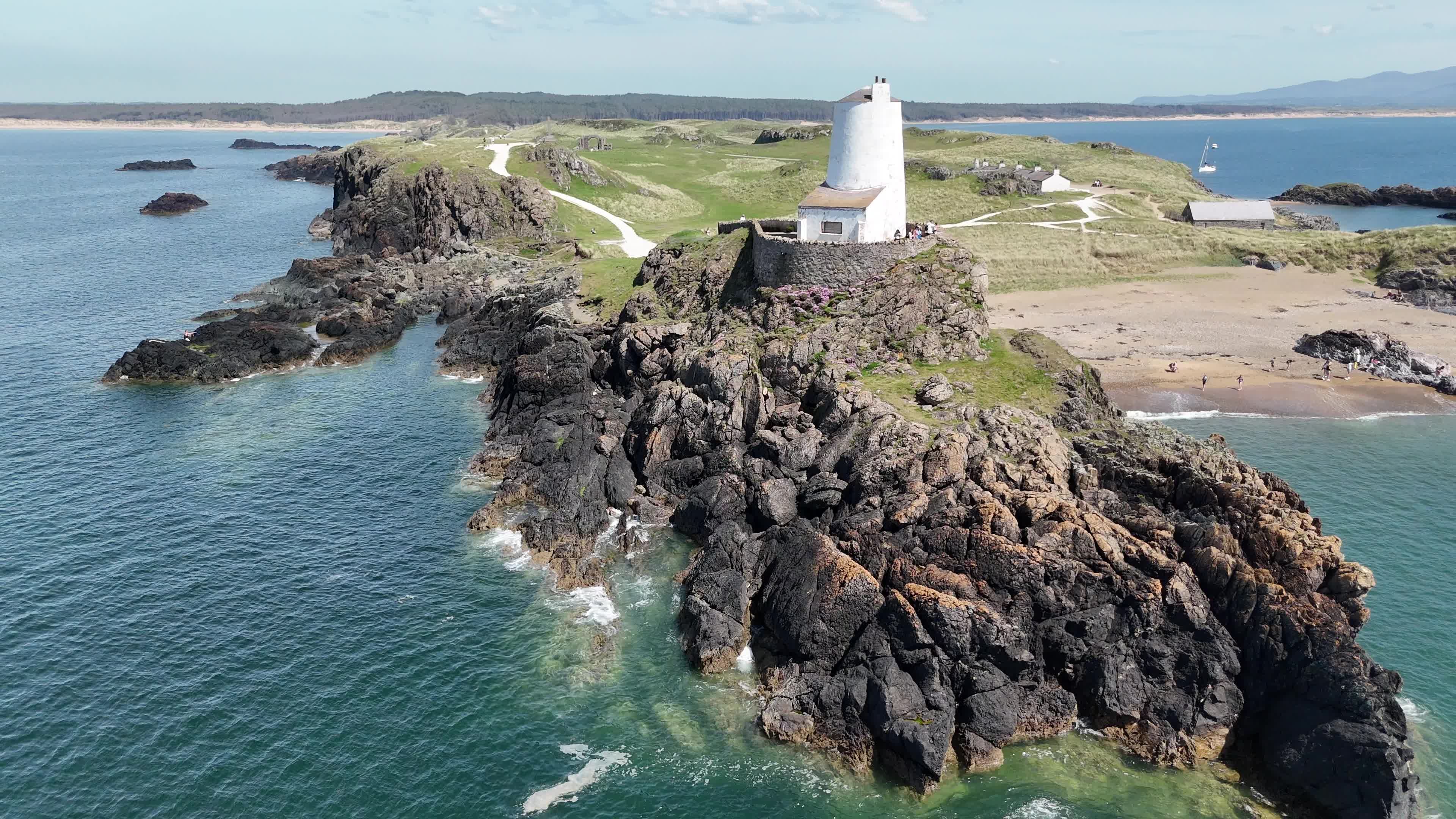 An aerial view of a lighthouse on the coast Free Stock Video Footage ...