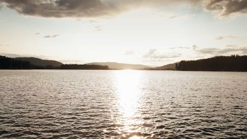 Sun Rays  On The Surface Of A Lake