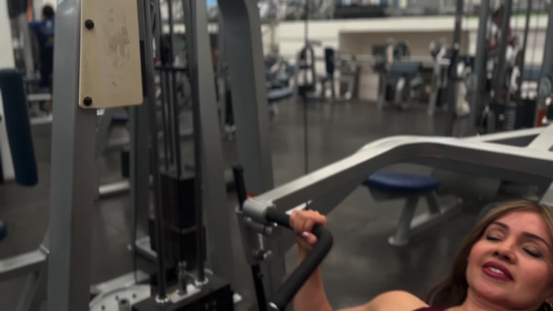 A woman is doing a bench press in a gym Free Stock Video Footage ...