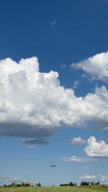 A plane flying over a blue sky with clouds Free Stock Video Footage ...