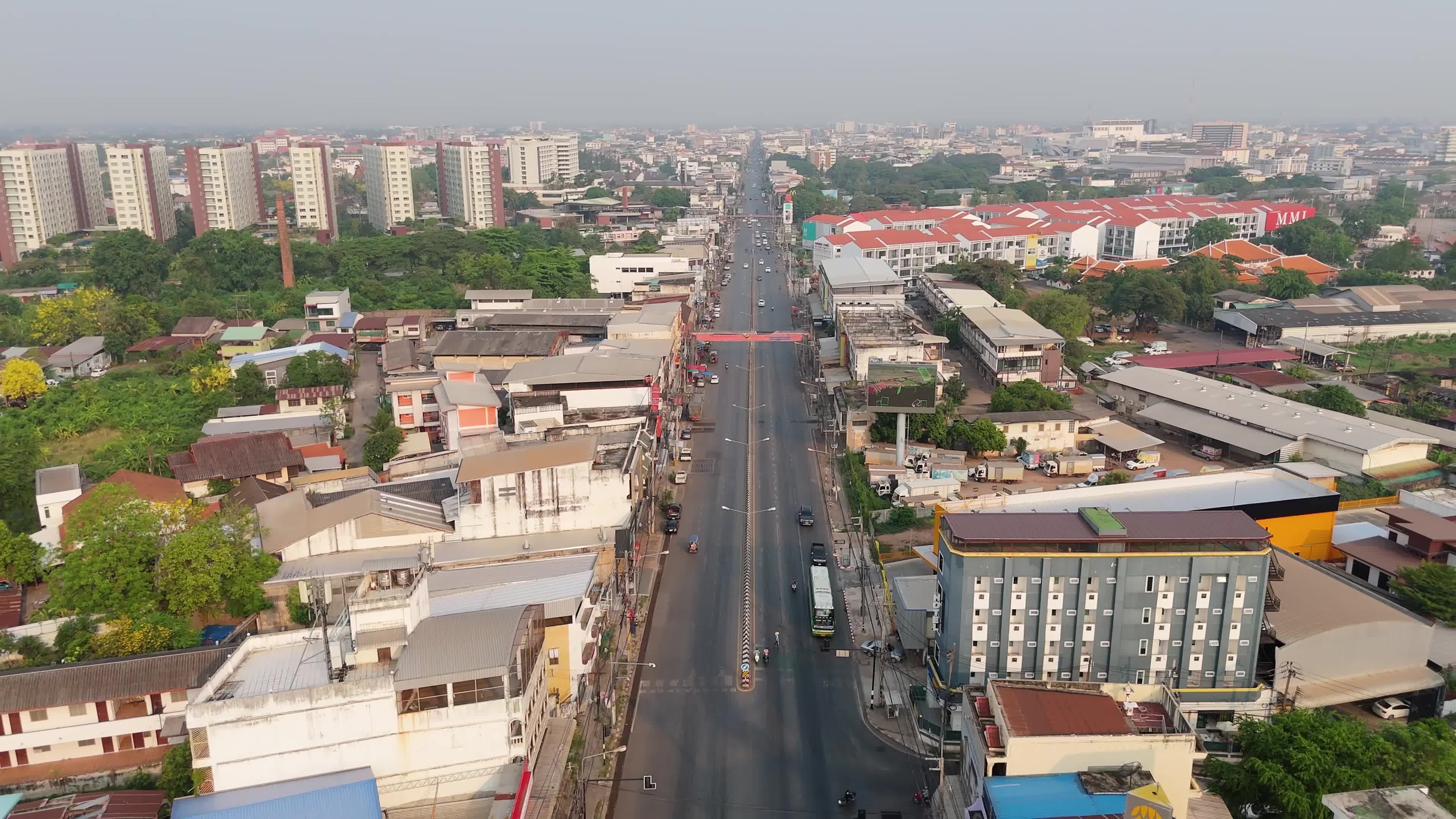An aerial view of a city street with cars and buildings Free Stock ...