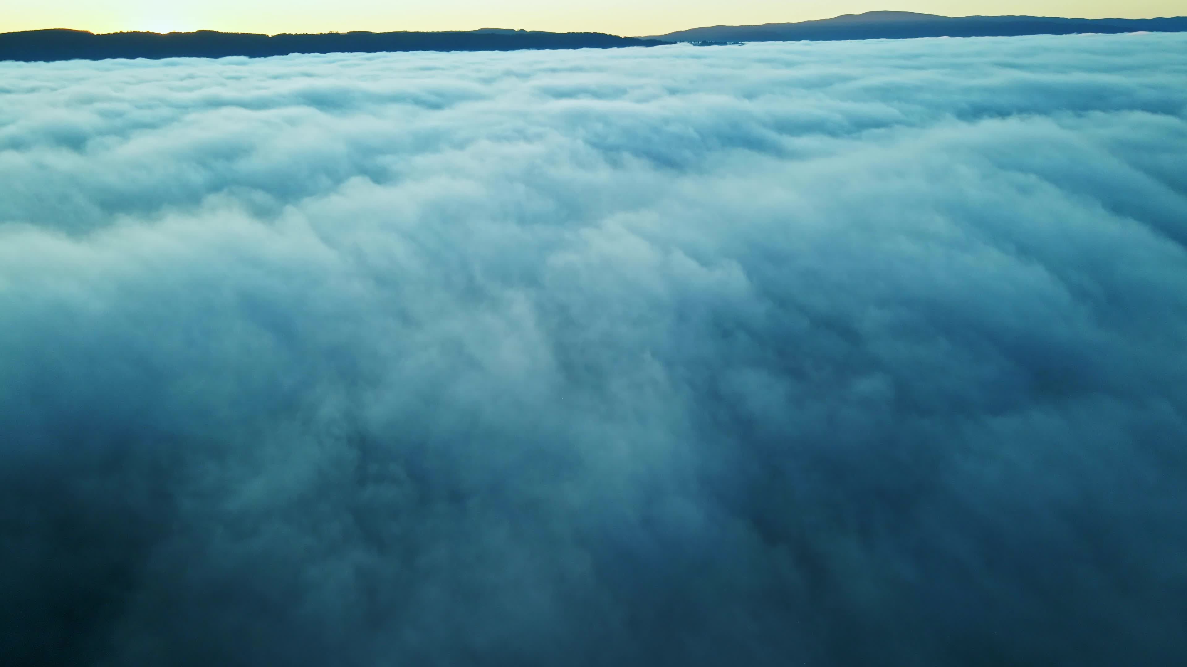 Aerial view of the sun rising over the clouds Free Stock Video Footage ...