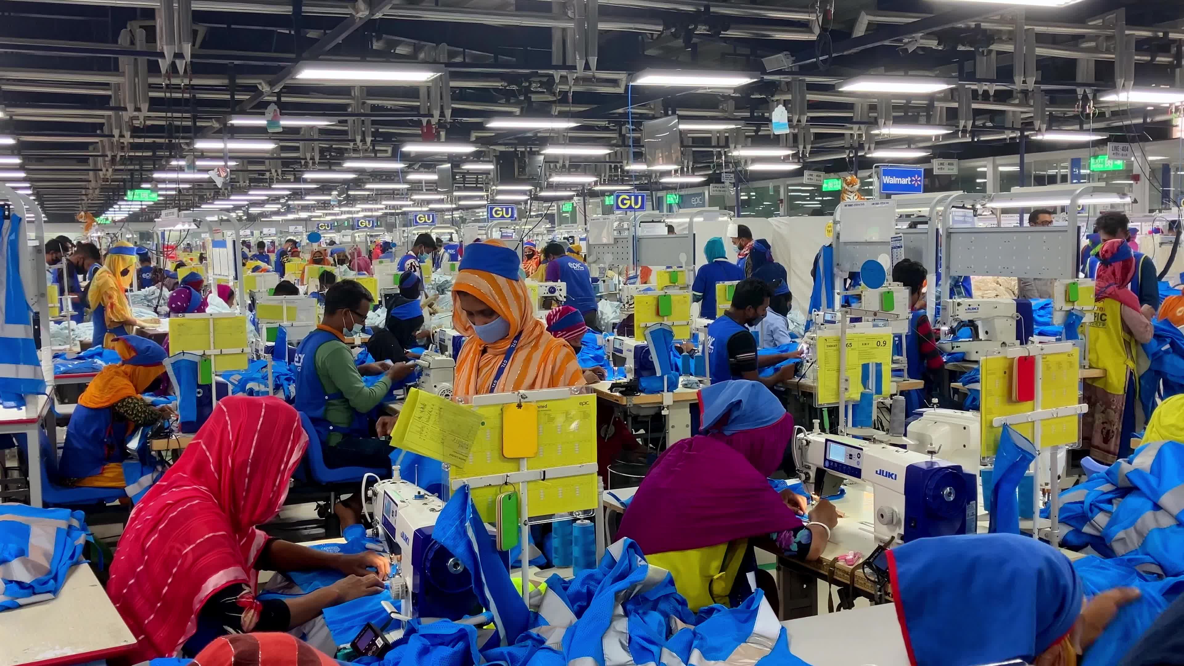 Workers in an industrial factory with many sewing machines Free Stock ...