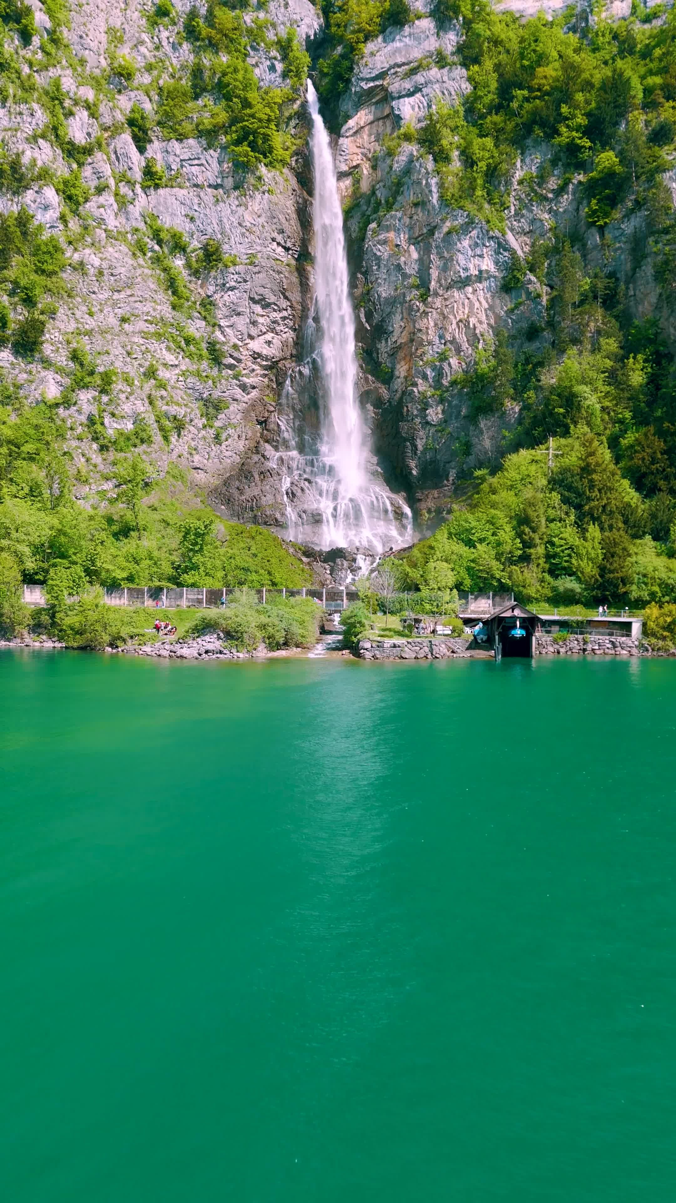 A waterfall is shown in the middle of a river Free Stock Video Footage ...