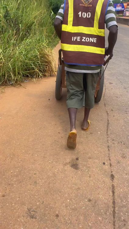 A man in a yellow vest walking down the road Free Stock Video Footage ...
