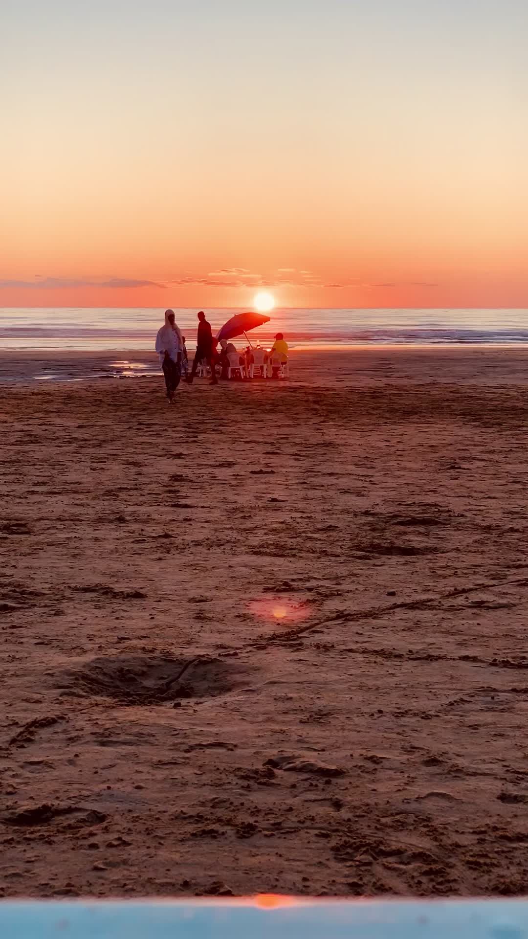 A beach with a sunset and a person on the beach Free Stock Video ...