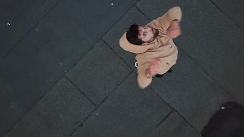 Man Wearing Hoodie On Top Of Building