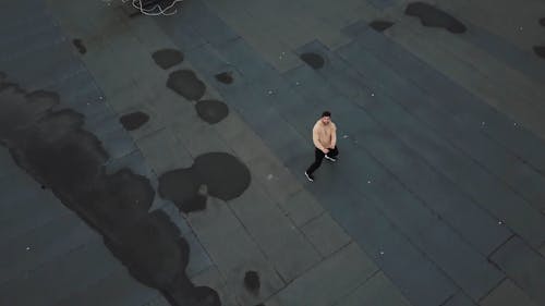 A Man Dancing On A Rooftop