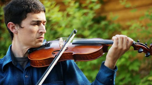 A Man Playing The Violin