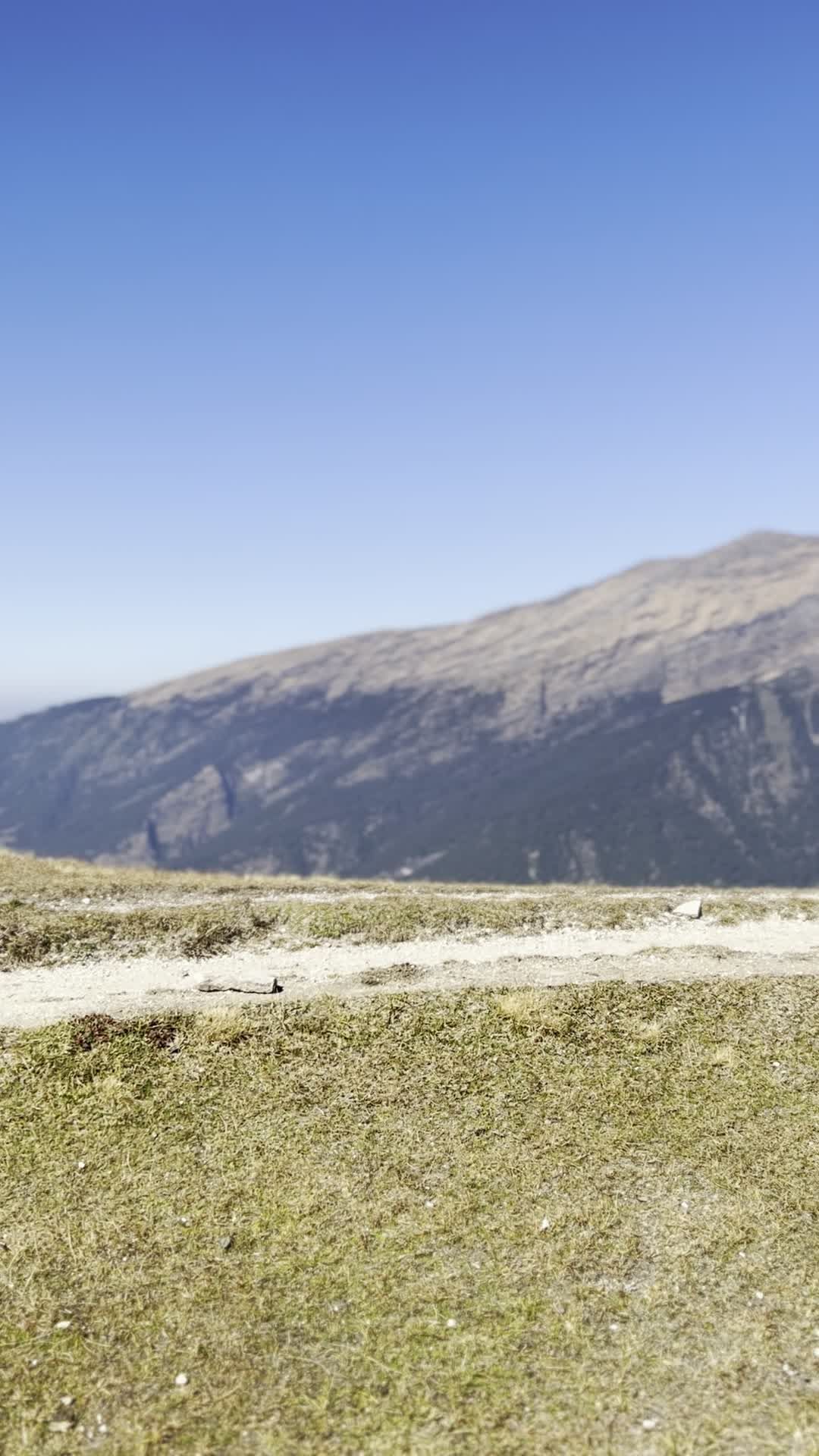a person with a backpack walking up a mountain 27946619