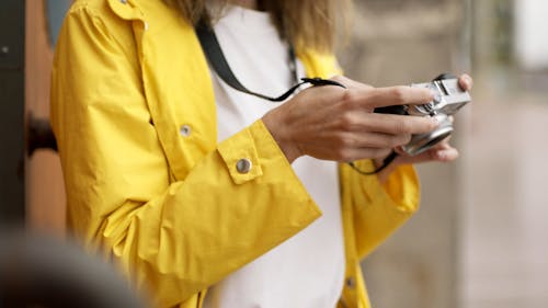 Close-Up View Of Woman Checking On Her Camera