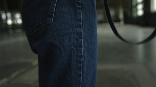 Woman Walking Inside A Building With Camera