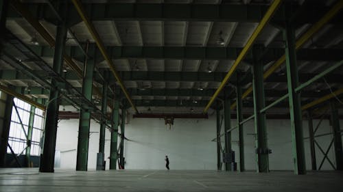 Man Dancing In A Covered Parking Lot