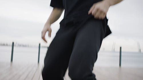 Man Dancing On A Wooden Deck