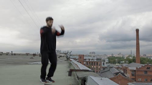 Man Dancing Hip-Hop On A Rooftop