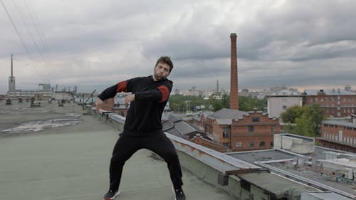 Man Dancing On Rooftop