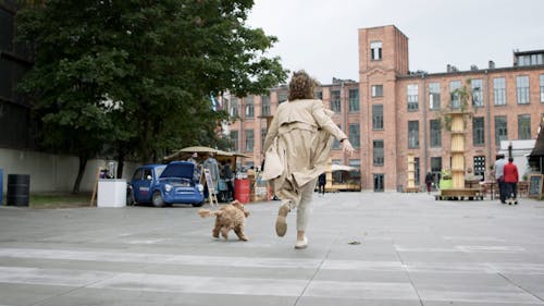 Woman Running With Her Dog