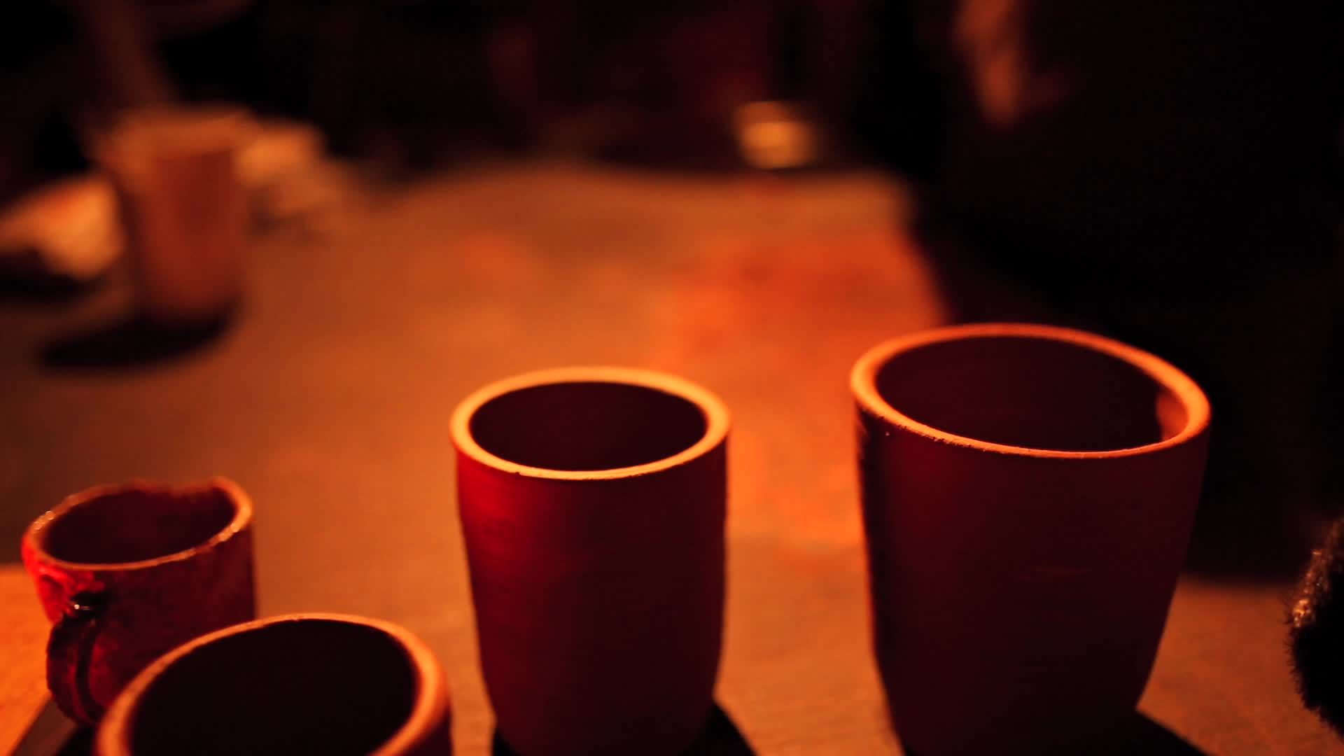 A group of clay pots sitting on a table Free Stock Video Footage ...
