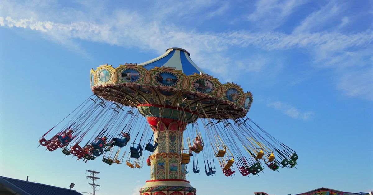 Blue Red Gull Ride A carnival ride with people on it and a blue sky Free Stock Video ...