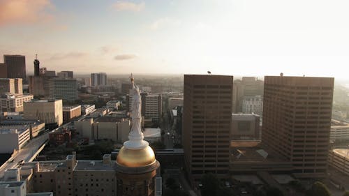 Aerial footage Of A Statue And Its Surrounding Urban Landscape