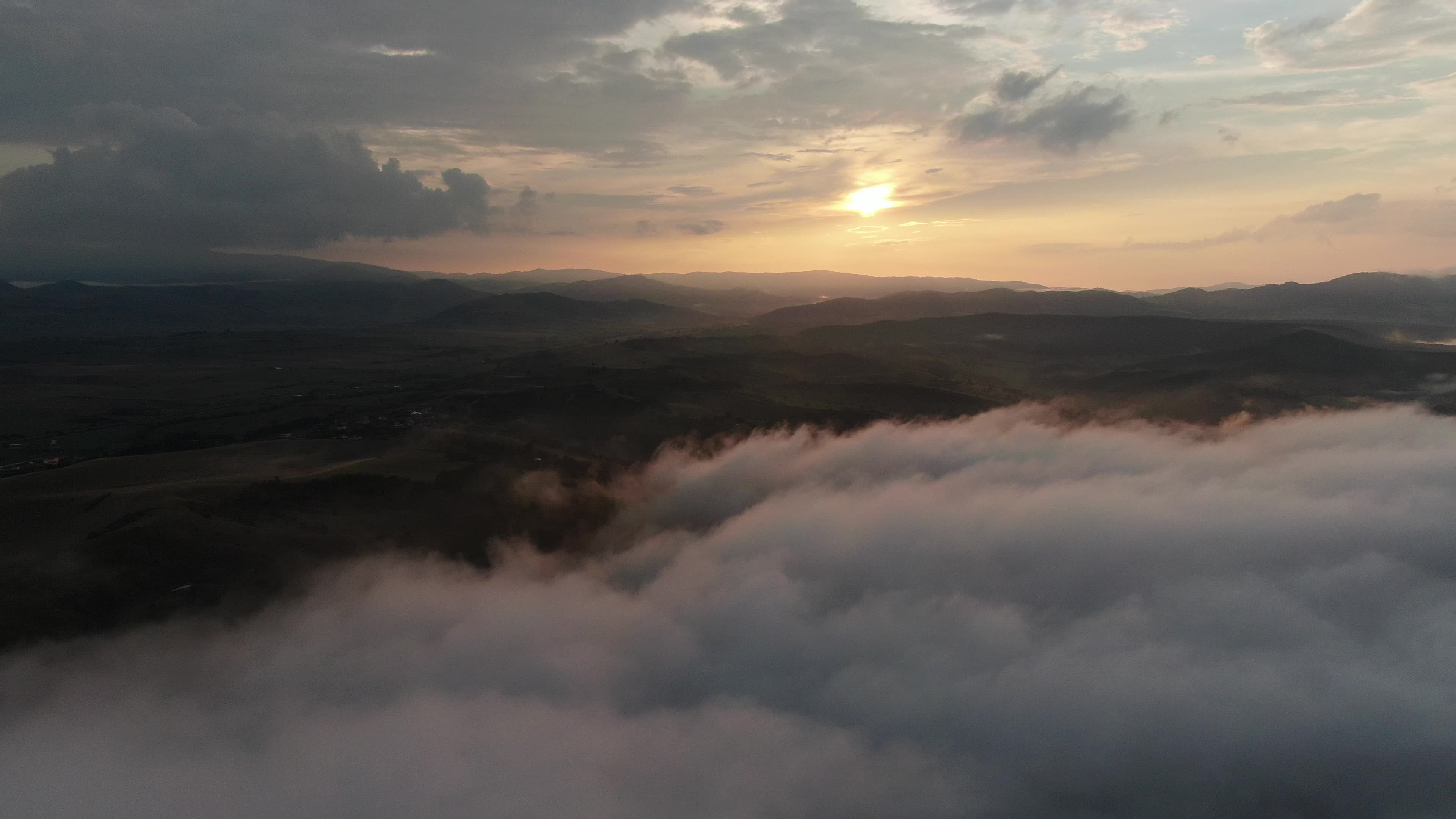 Aerial view of the clouds and sun rising over the valley Free Stock ...