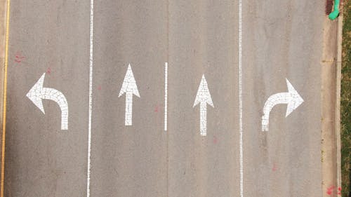 Painted Arrows In A Road For Direction