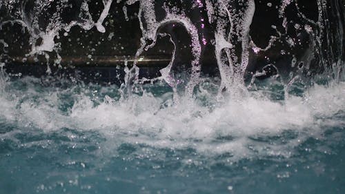 A Man Made Waterfall In A Swimming Pool