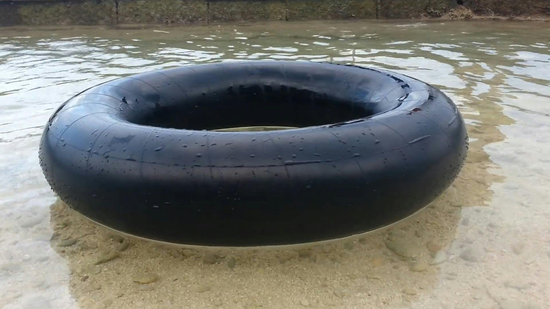 An Inflated Tube Tire Used As Floating Device · Free Stock Video