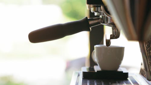 A Cup Of Hot Coffee Made From A Coffee Maker Machine