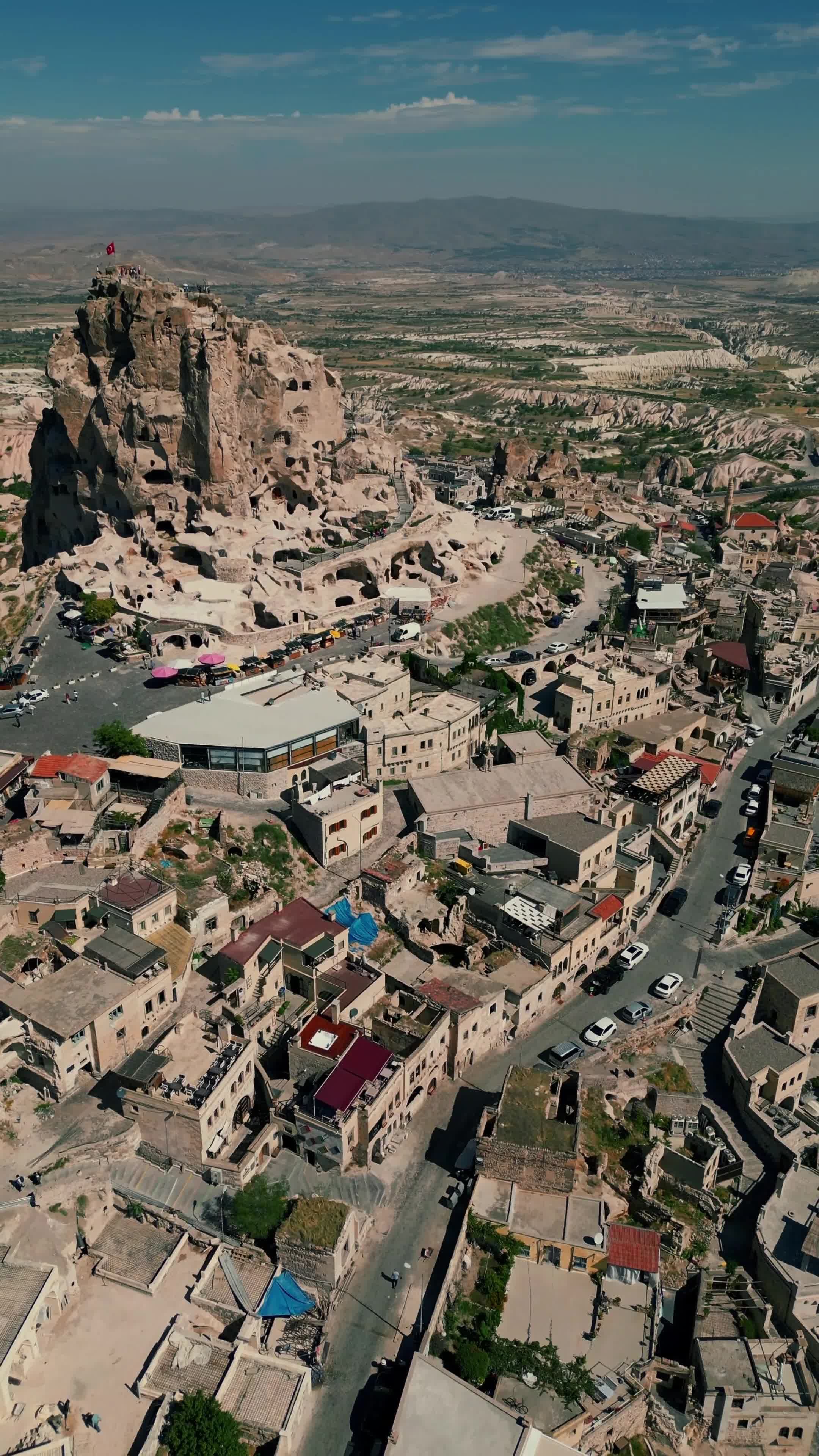 An aerial view of a city with a mountain in the background Free Stock ...