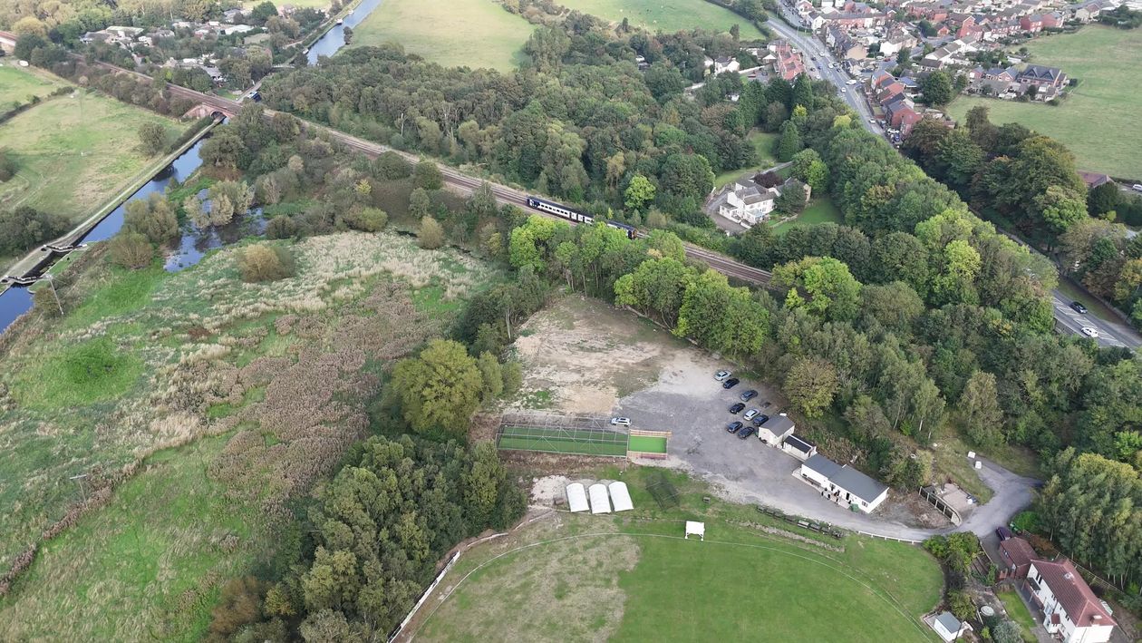 An aerial view of a field with trees and grass Free Stock Video Footage ...