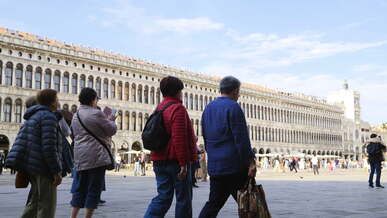 tourists walking in the square
